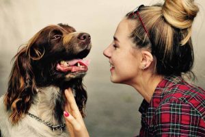 Picture of woman talking to a dog