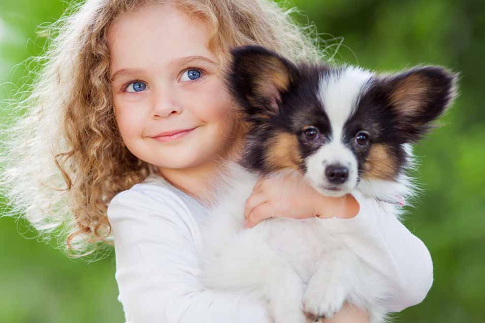 Picture of a girl holding a dog