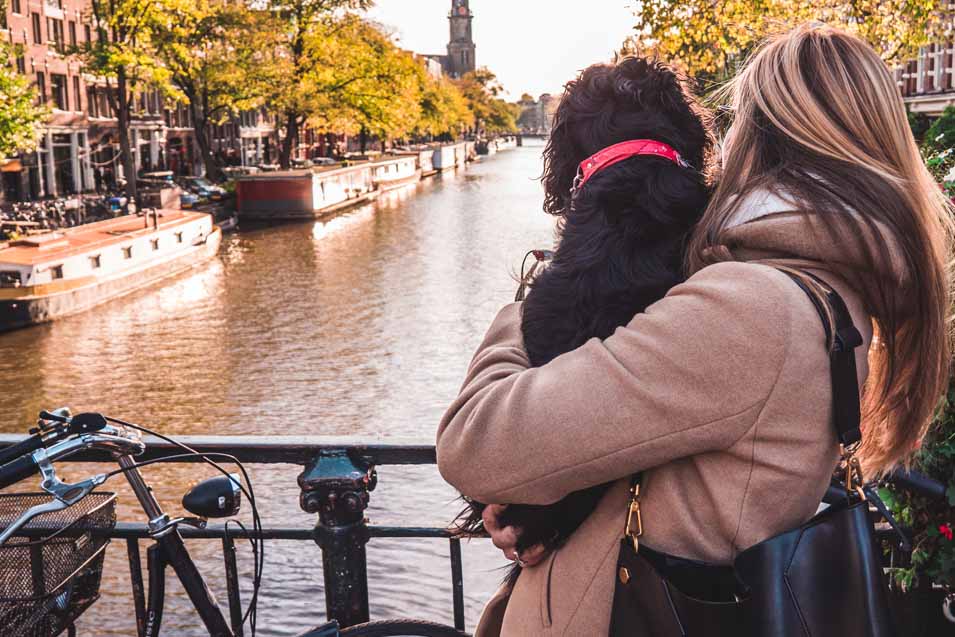 Picture of a woman holding a dog in Amsterdam