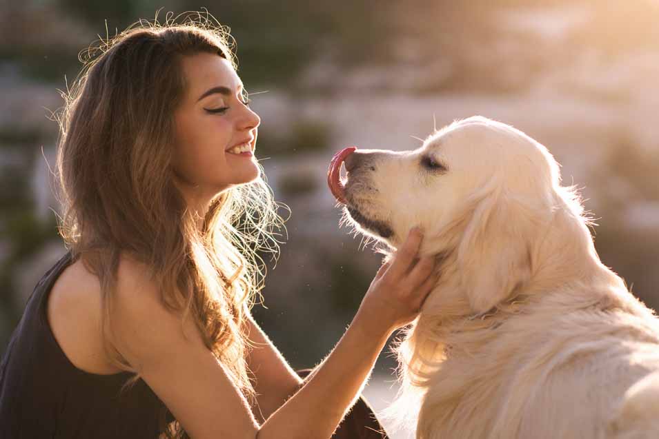 Picture of a woman petting her dog