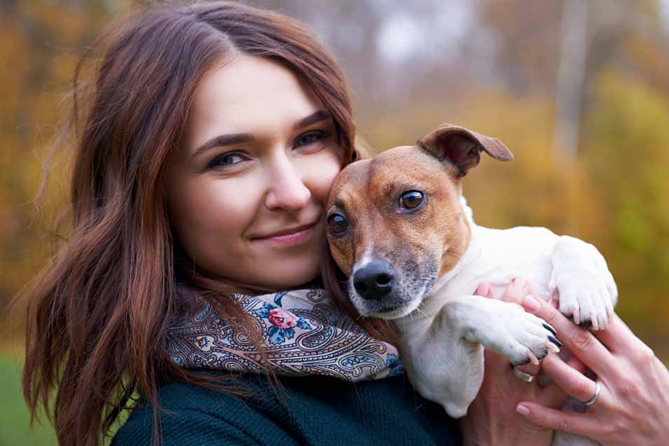 Picture of a woman holding a dog