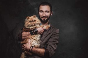 Picture of a man and a cat
