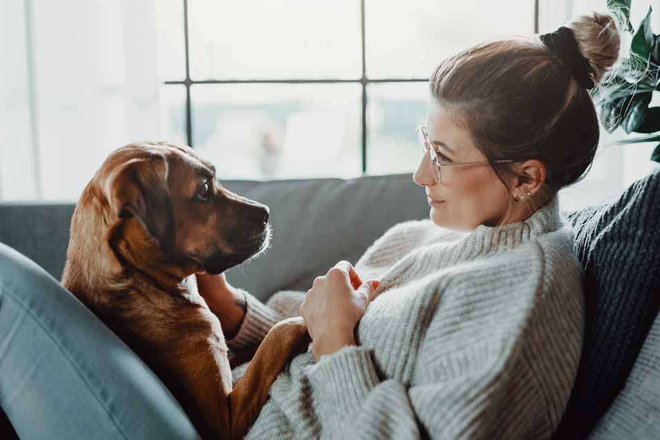Woman and her dog at home