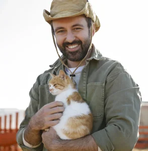 farmer and his orange cat