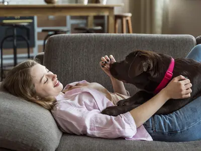 Girl and dog on the sofa