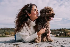 woman and dog on the beach