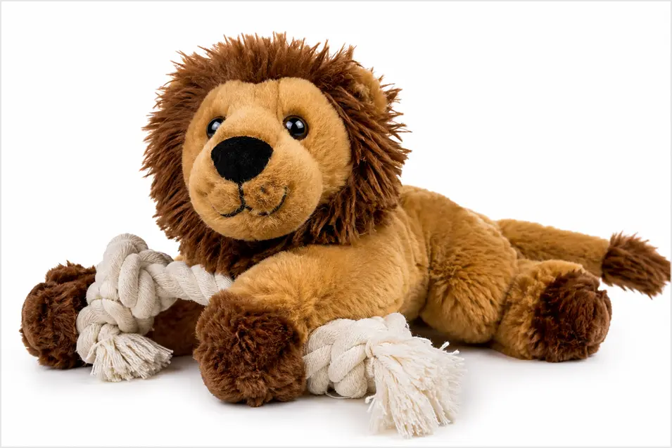 Plush lion dog toy with a sturdy cotton rope, photographed on a clean white background with soft studio lighting for a crisp commercial product look.