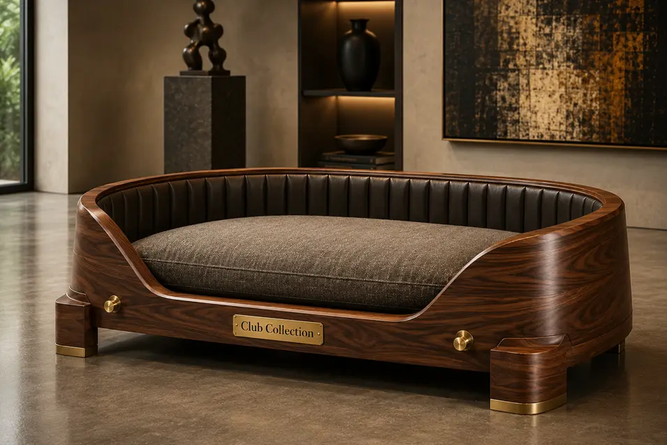 Luxury walnut dog bed with brass accents, quilted leather detailing and a plush charcoal cushion, blending Art Deco elegance with modern craftsmanship.