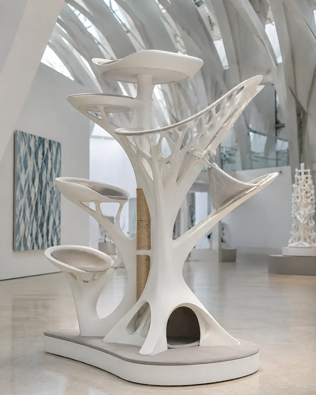 Santiago Calatrava-inspired luxury cat tree with sweeping organic forms, skeletal elegance, sculptural perches, and futuristic architectural design.