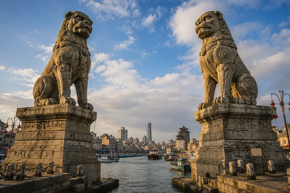 Two monumental stone guardian dogs stand at the entrance to a bustling historic harbor, framed by boats, city buildings, and blue sky.