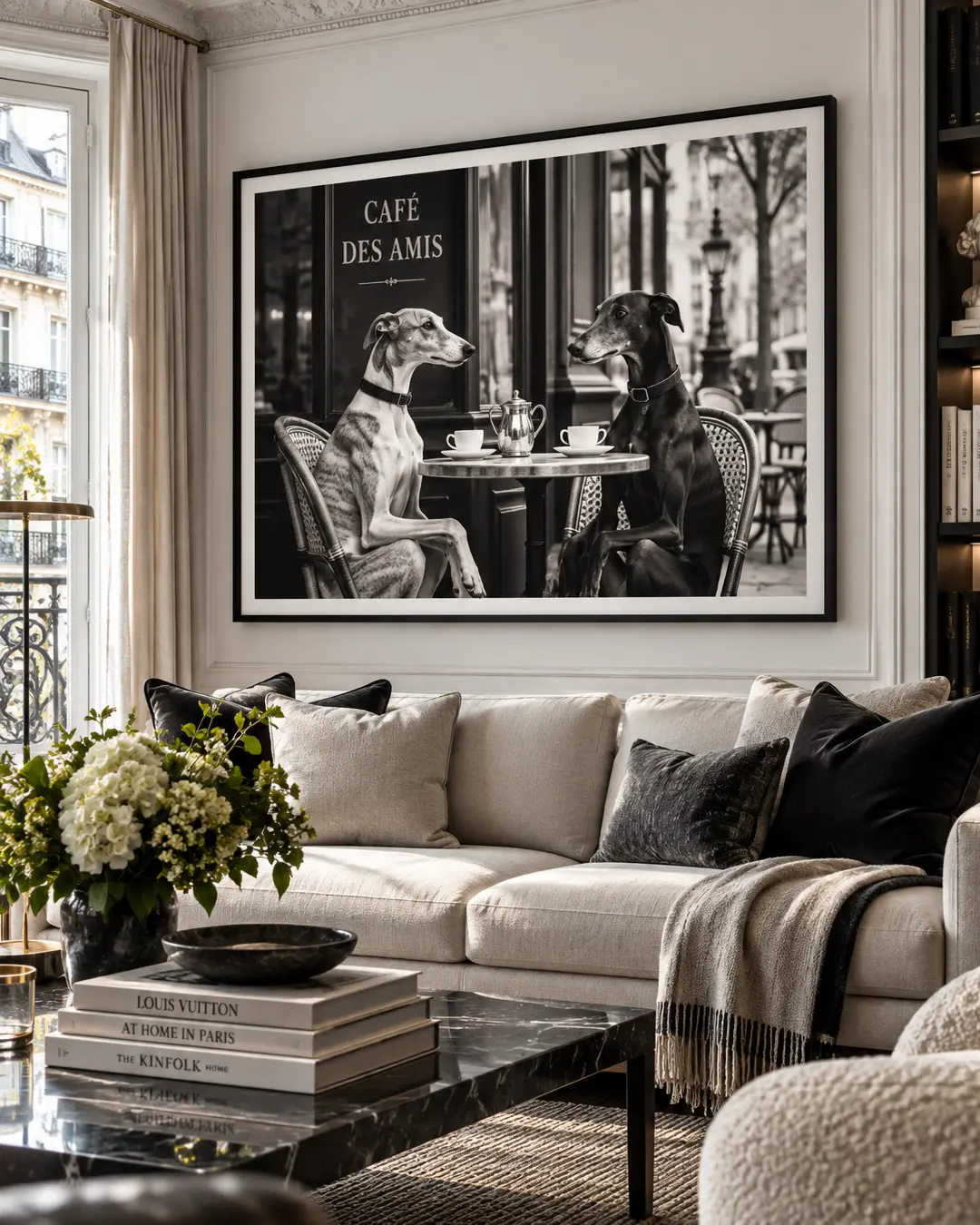 A chic Parisian living room features oversized black-and-white art of two elegant dogs sharing coffee at a sidewalk café.